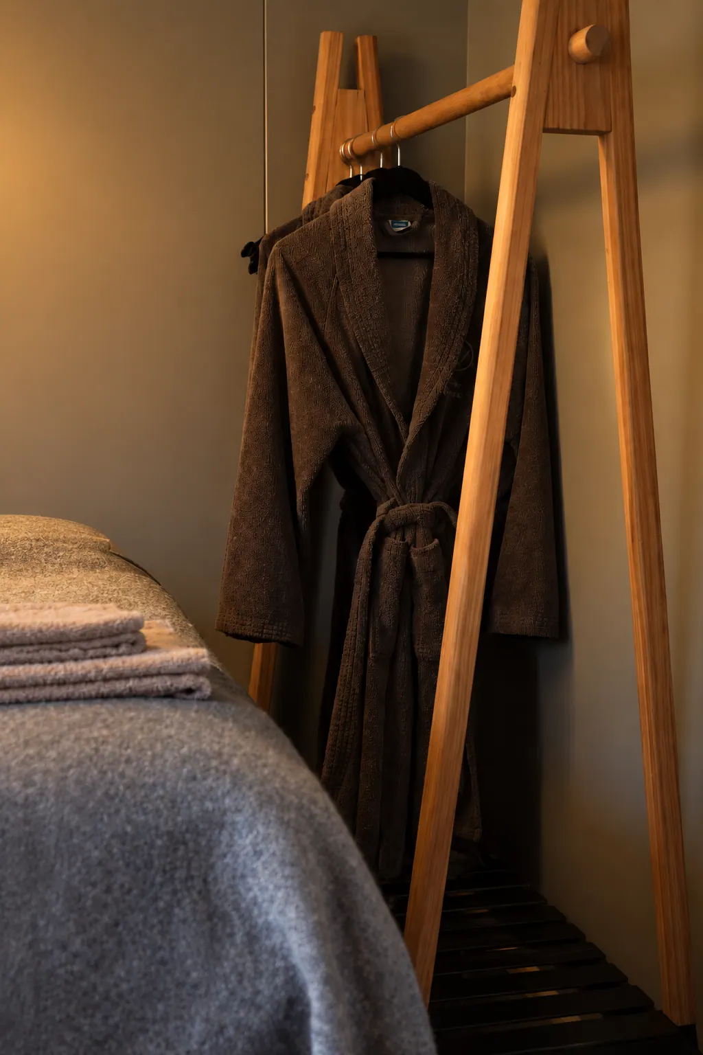 The Cottage: Clothes rail and ladder shelf by the bed