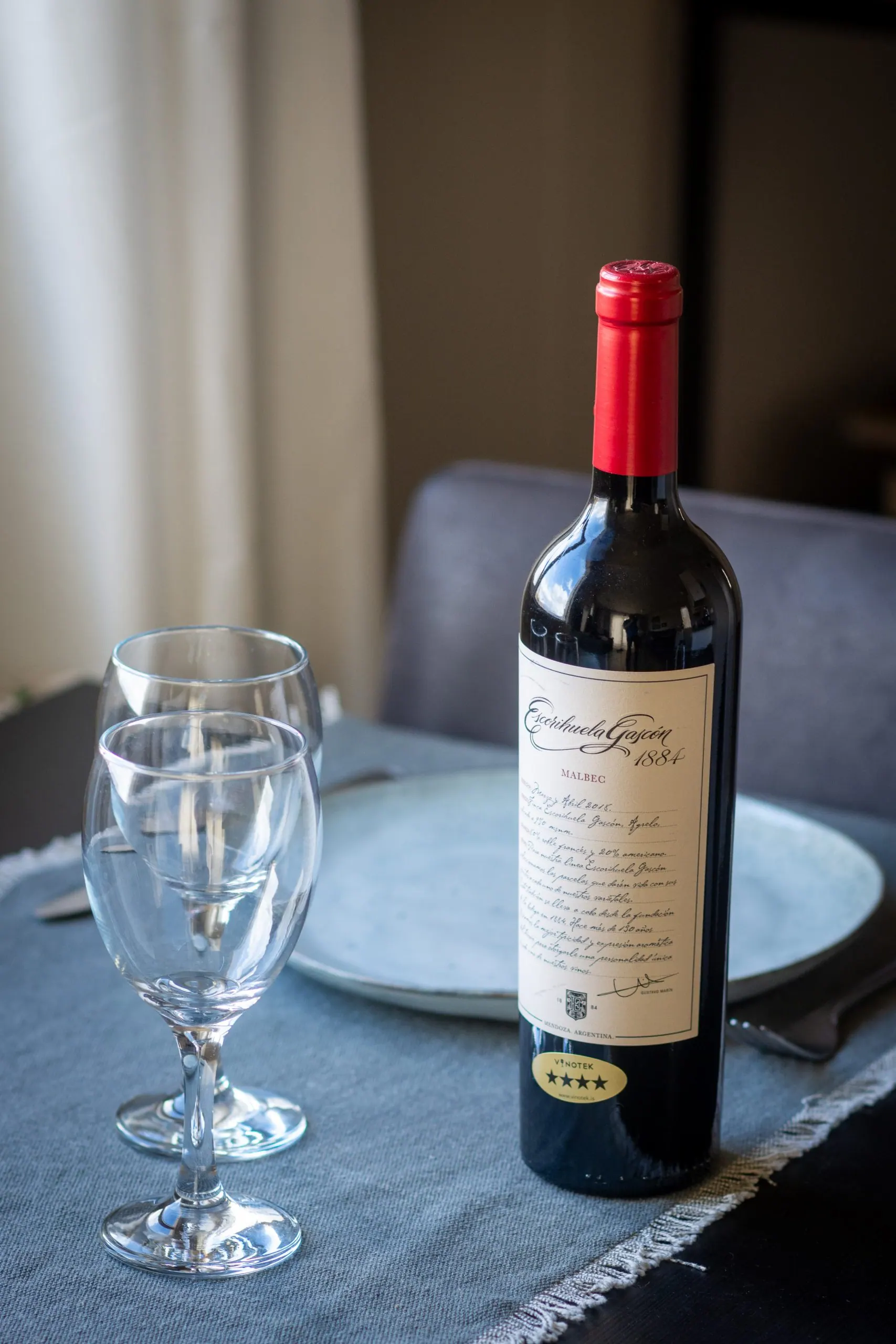 The Cottage: Red wine and glasses on the table