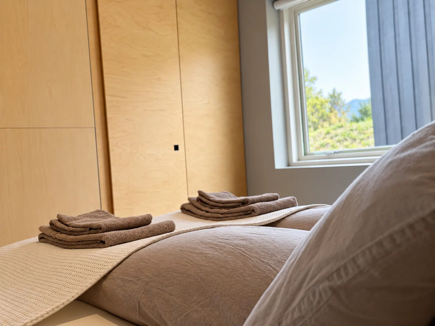 Apartment 15B: Bedroom window with folded towels