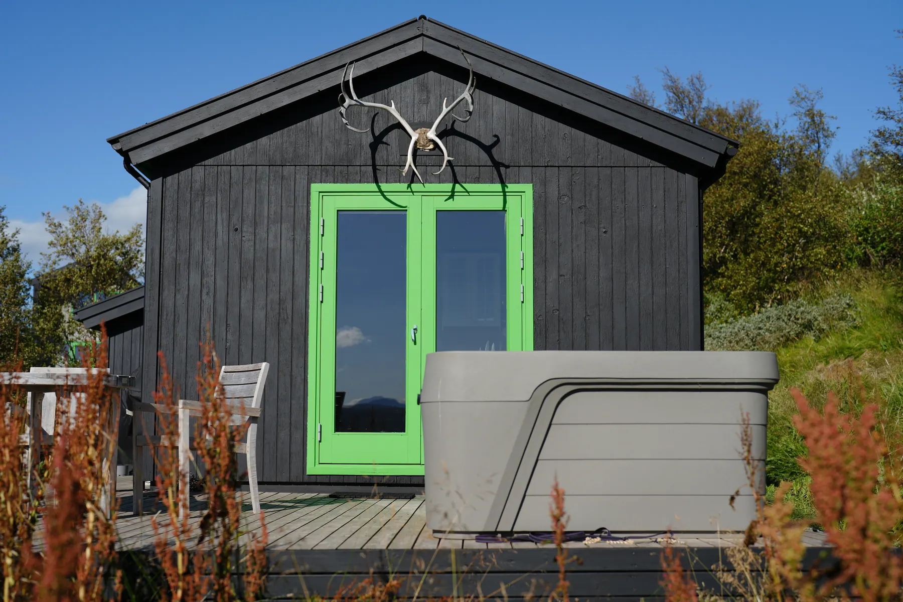 The Cottage: The Cottage with its hot tub in summer