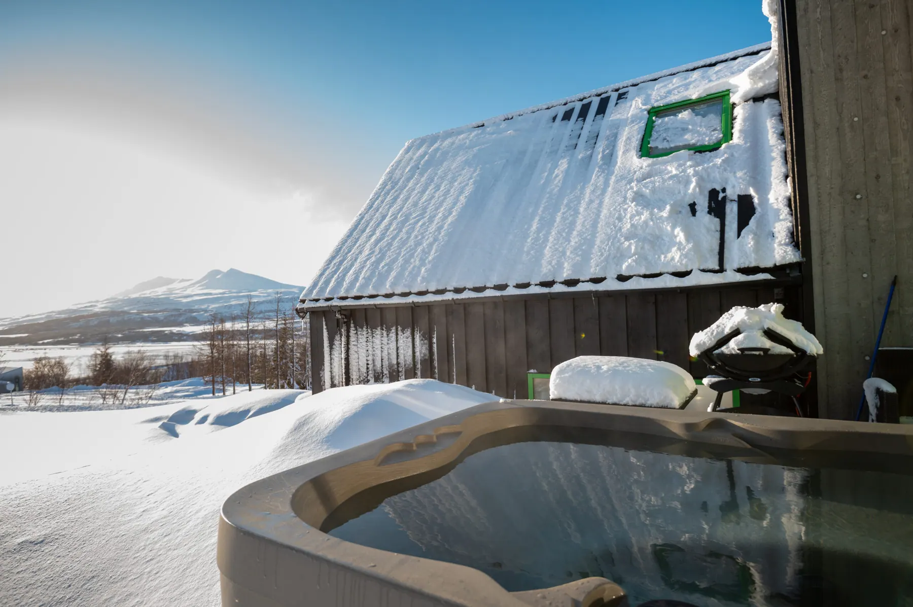 Private hot tub on a VADLA terrace overlooking the fjord