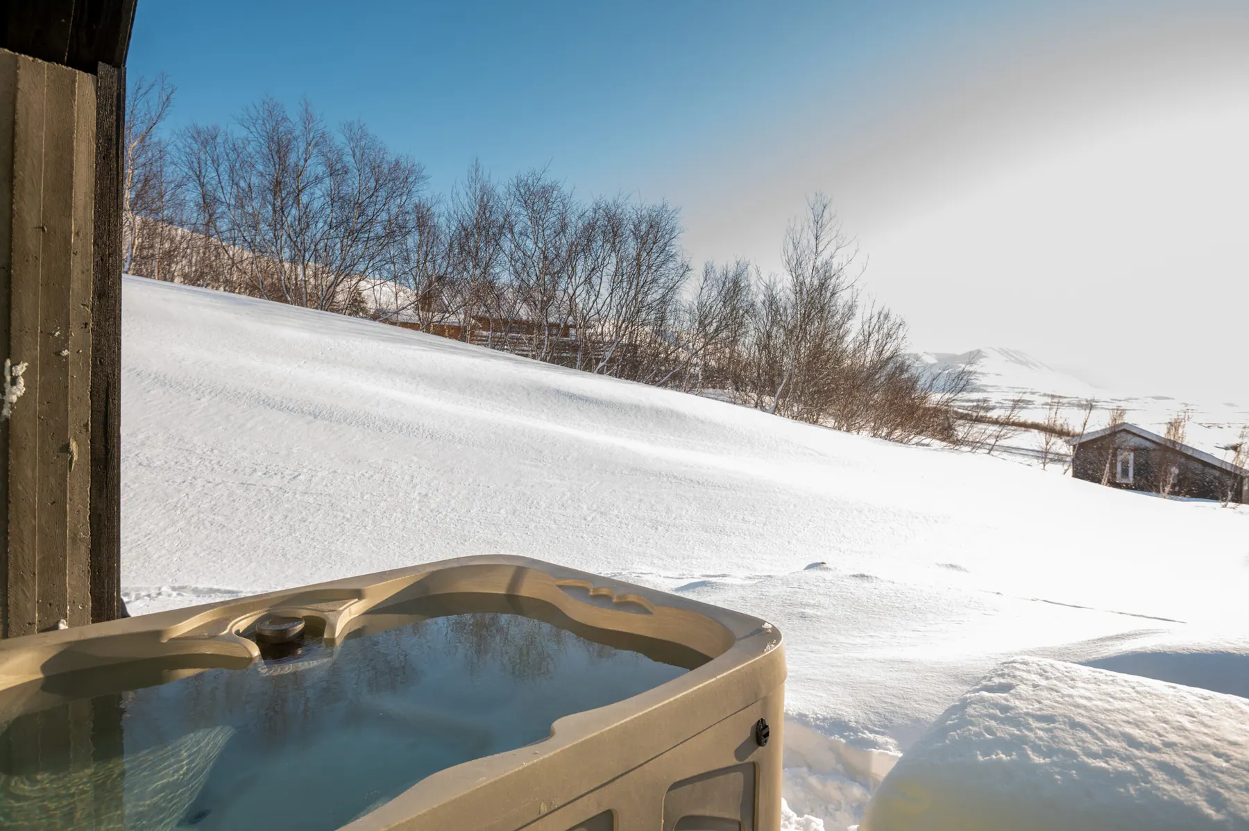 Apartment 15A: Hot tub in the snow on the hillside