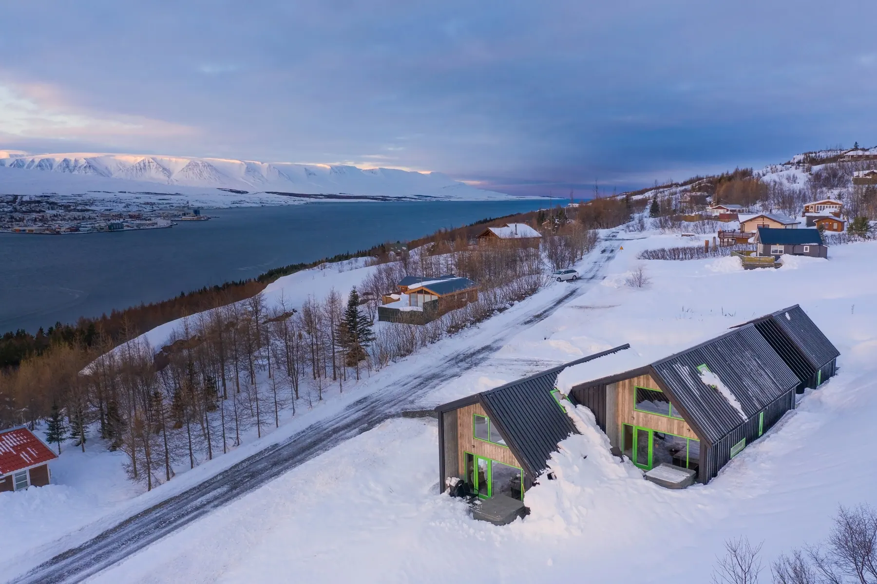 Apartment 15C: The houses in snow above the fjord