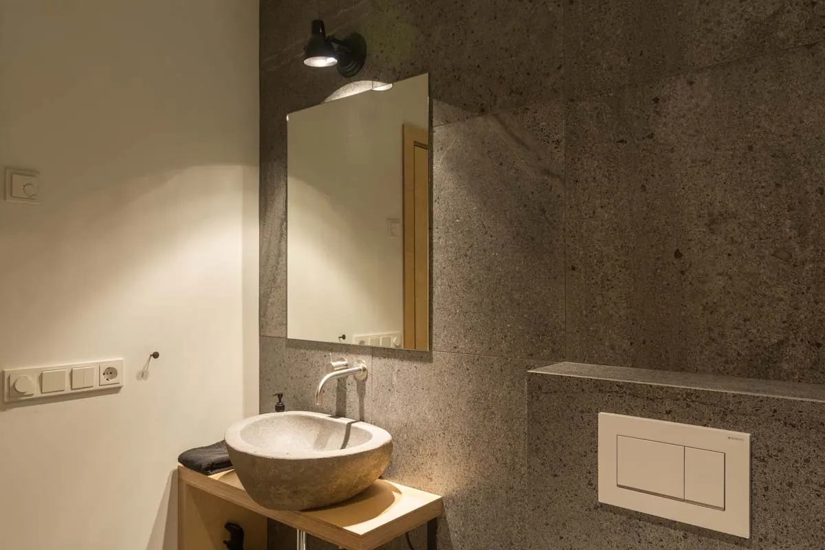 Apartment 15A: Bathroom basin and mirror